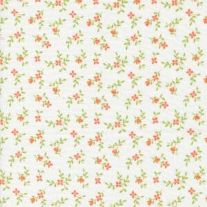 Delicate floral pattern with small orange and green flowers on a white background.