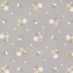Soft gray fabric with a delicate white and yellow floral pattern.