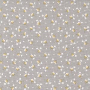 A subtle floral pattern with yellow and white flowers on a light gray background.