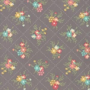 Vintage floral pattern with small colorful flowers on a gray background.
