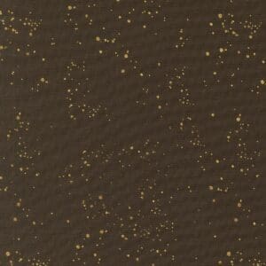 Dark brown textured surface with scattered tiny golden specks.