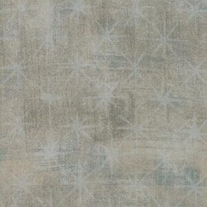 Abstract textured surface with muted gray and beige tones.