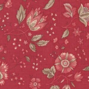 Red floral patterned fabric with beige leaves.