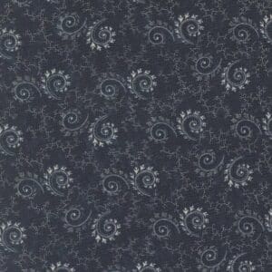 Dark fabric with white paisley pattern.