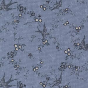 Blue fabric with birds and floral pattern.