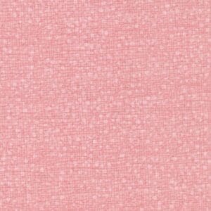 Pink textured fabric with small grid pattern.