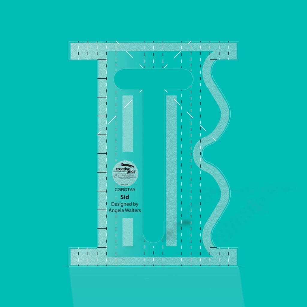 Transparent quilting ruler on turquoise background.