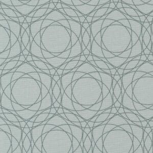 Geometric pattern with overlapping circles on fabric.