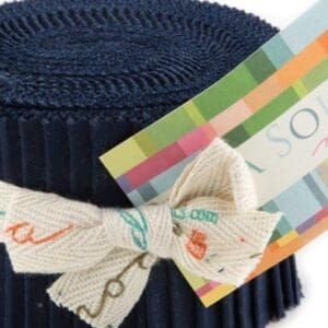 Fabric roll with colorful label and bow.