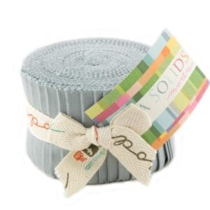 Fabric roll with colorful label and ribbon.
