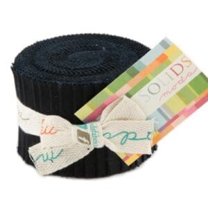 Rolled fabric with colorful label and bow.