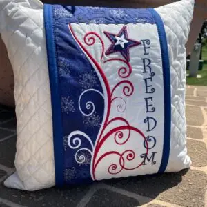 Quilted patriotic pillow embroidered with FREEDOM