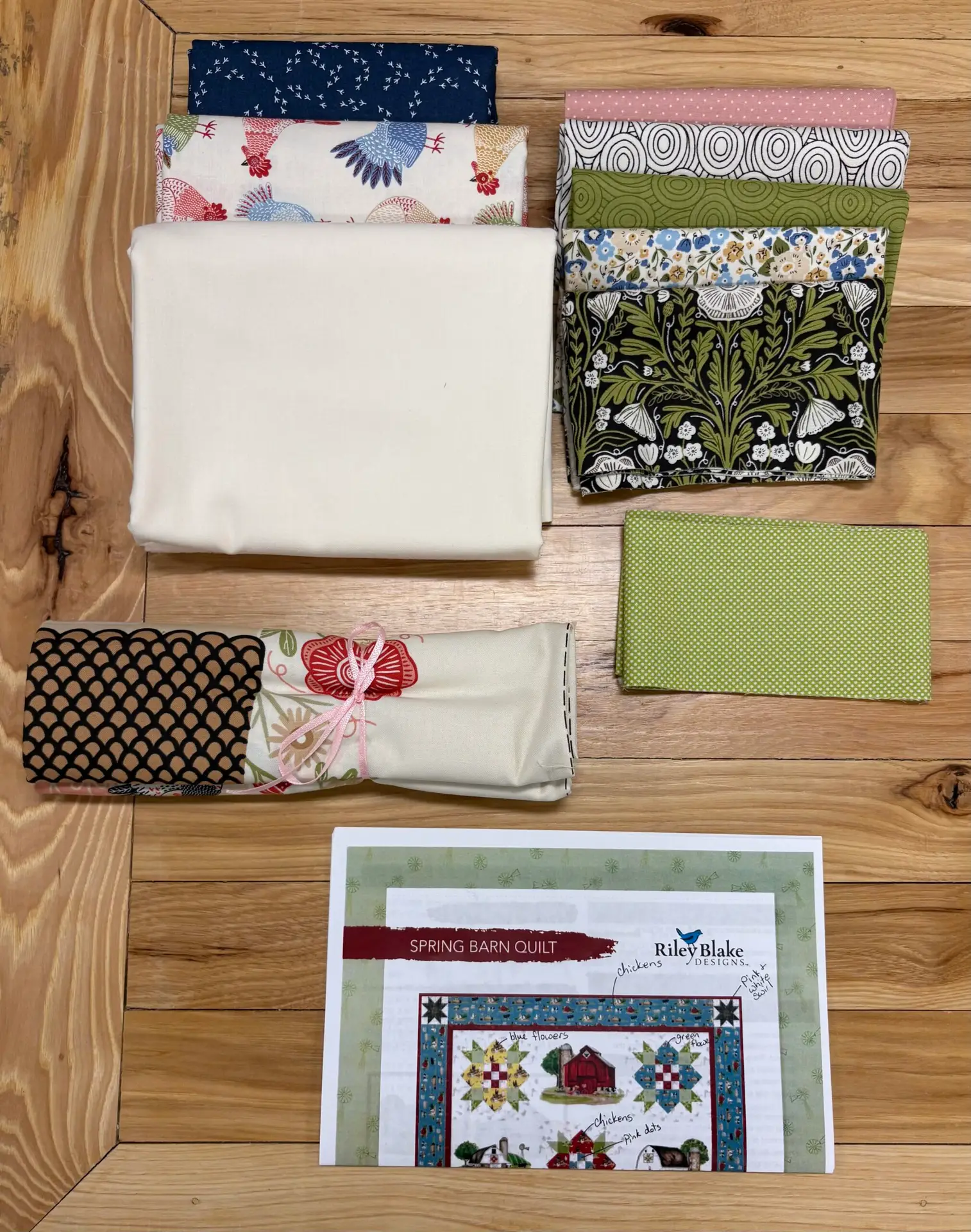 Quilting fabric bundle with pattern on wood
